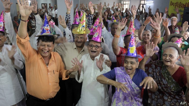 Happy elderly people dancing